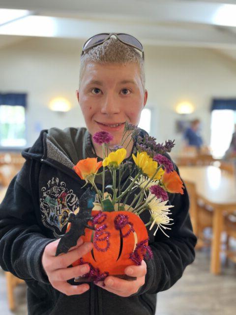 Student holding his horticulture project